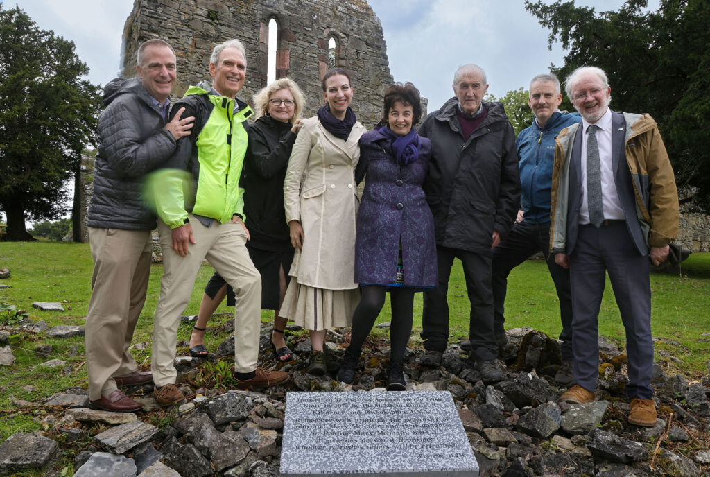 Image of McShain Family unveiling plaque at Innisfallen Island.